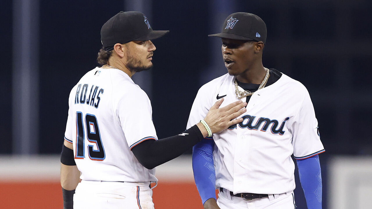 MIAMI, FLORIDA - JULY 06: Miguel Rojas #19 and Jazz Chisholm Jr. #2 of the Miami Marlins celebrate against the Los Angeles Dodgers at loanDepot park on July 06, 2021 in Miami, Florida.