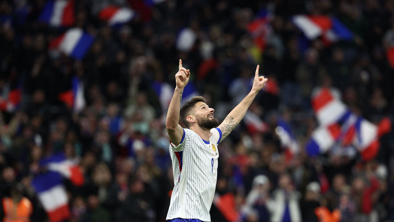 France's forward #09 Olivier Giroud celebrates scoring his team's third goal during the friendly football match between France and Chile at the Stade Velodrome in Marseille, southern France, on March 26, 2024.