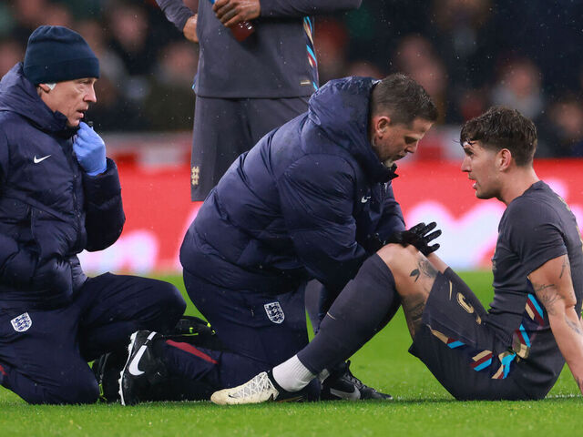 LONDON, ENGLAND - MARCH 26: John Stones of England is treated before being forced of with an injury during the international friendly match between England and Belgium at Wembley Stadium on March 26, 2024 in London, England.