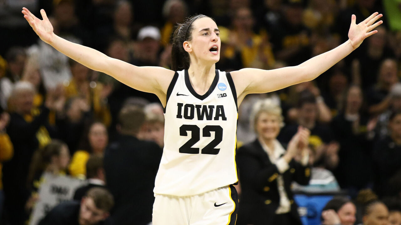 IOWA CITY, IOWA- MARCH 25: Guard Caitlin Clark #22 of the Iowa Hawkeyes celebrates after drawing a foul late in the second half against the West Virginia Mountaineers during their second round match-up in the 2024 NCAA Division 1 Women's Basketball Championship at Carver-Hawkeye Arena on March 25, 2024 in Iowa City, Iowa.
