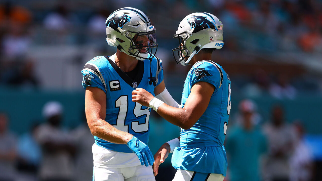 MIAMI GARDENS, FLORIDA - OCTOBER 15: Bryce Young #9 and Adam Thielen #19 of the Carolina Panthers celebrate a touchdown during the first quarter in the game against the Miami Dolphins at Hard Rock Stadium on October 15, 2023 in Miami Gardens, Florida.
