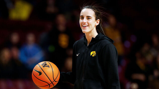 MINNEAPOLIS, MINNESOTA - FEBRUARY 28: Caitlin Clark #22 of the Iowa Hawkeyes smiles as she warms up prior to the start of the game against the Minnesota Golden Gophers at Williams Arena on February 28, 2024 in Minneapolis, Minnesota. The Hawkeyes defeated the Golden Gophers 108-60.