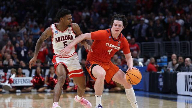 LOS ANGELES, CALIFORNIA - MARCH 28: Ian Schieffelin #4 of the Clemson Tigers drives against KJ Lewis #5 of the Arizona Wildcats during the second half in the Sweet 16 round of the NCAA Men's Basketball Tournament at Crypto.com Arena on March 28, 2024 in Los Angeles, California.