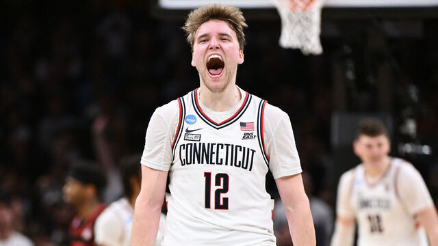 BOSTON, MASSACHUSETTS - MARCH 28: Cam Spencer #12 of the Connecticut Huskies celebrates a point against the San Diego State Aztecs during the second half of the NCAA Tournament held at TD Garden on March 28, 2024 in Boston, Massachusetts.