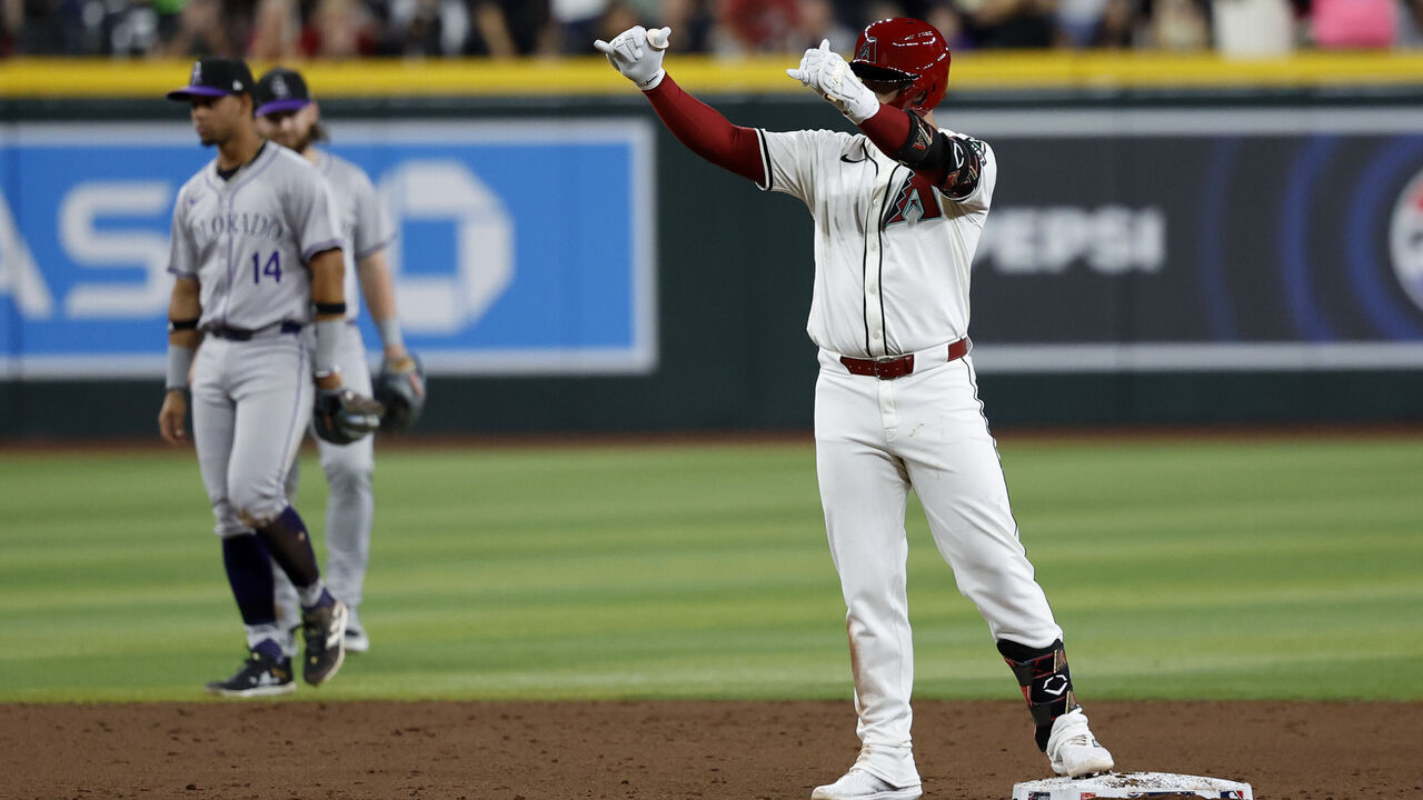 PHOENIX, AZ - MARCH 28: Christian Walker #53 of the Arizona Diamondbacks reacts after hitting a RBI double in the third inning of the game between the Colorado Rockies and the Arizona Diamondbacks at Chase Field on Thursday, March 28, 2024 in Phoenix, Arizona.