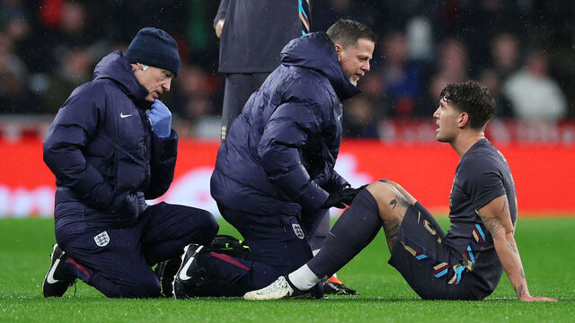LONDON, ENGLAND - MARCH 26: John Stones of England receives medical treatment after picking up an injury before being substituted during the international friendly match between England and Belgium at Wembley Stadium on March 26, 2024 in London, England.