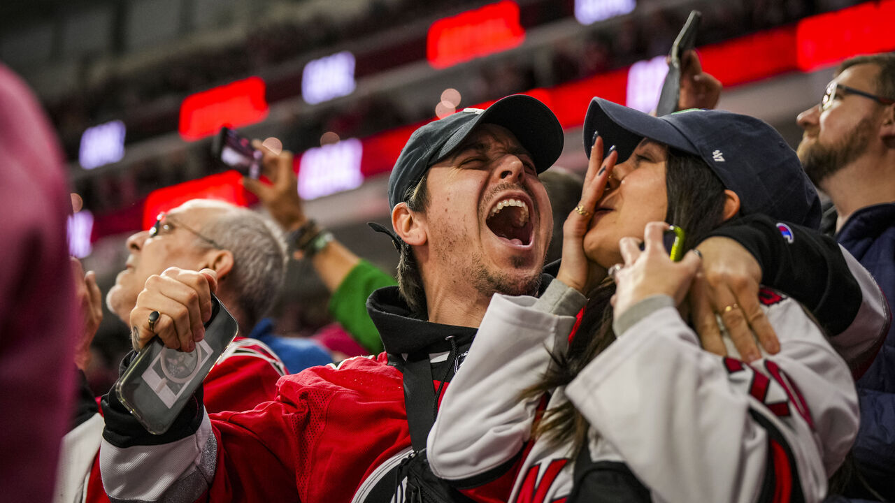 RALEIGH, NORTH CAROLINA - MARCH 07: Carolina Hurricanes fans celebrate a goal during the third period of a game against the Montréal Canadiens at PNC Arena on March 07, 2024 in Raleigh, North Carolina.