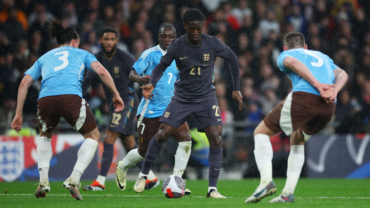 LONDON, ENGLAND - MARCH 26: Kobbie Mainoo of England controls the ball whilst under pressure from Arthur Theate of Belgium during the international friendly match between England and Belgium at Wembley Stadium on March 26, 2024 in London, England.