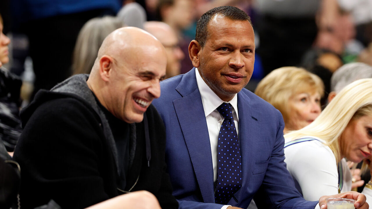 MINNEAPOLIS, MINNESOTA - DECEMBER 30: Co-owners Alex Rodriguez (R) and Marc Lore of the Minnesota Timberwolves look on in the second quarter during the game against the Los Angeles Lakers at Target Center on December 30, 2023 in Minneapolis, Minnesota.