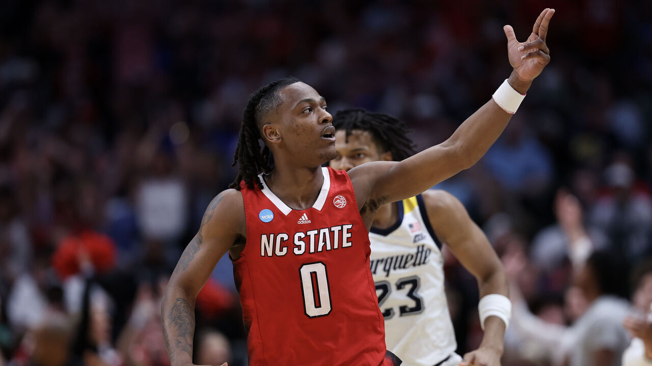 DALLAS, TEXAS - MARCH 29: DJ Horne #0 of the North Carolina State Wolfpack reacts against the Marquette Golden Eagles during the second half in the Sweet 16 round of the NCAA Men's Basketball Tournament at American Airlines Center on March 29, 2024 in Dallas, Texas.