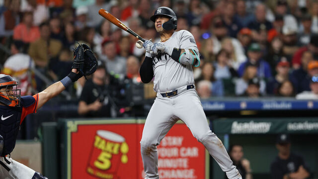 HOUSTON, TEXAS - MARCH 29: Gleyber Torres #25 of the New York Yankees is hit by a pitch in the seventh inning \ah at Minute Maid Park on March 29, 2024 in Houston, Texas.