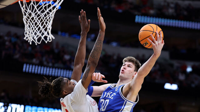 DALLAS, TEXAS - MARCH 29: Kyle Filipowski #30 of the Duke Blue Devils shoots over Ja'Vier Francis #5 of the Houston Cougars during the second half of the Sweet 16 round of the NCAA Men's Basketball Tournament at American Airlines Center on March 29, 2024 in Dallas, Texas.