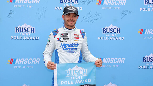 RICHMOND, VIRGINIA - MARCH 30: Kyle Larson, driver of the #5 HendrickCars.com Chevrolet, poses for photos after winning the pole award during qualifying for the NASCAR Cup Series Toyota Owners 400 at Richmond Raceway on March 30, 2024 in Richmond, Virginia.