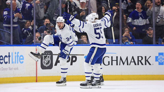 BUFFALO, NEW YORK - MARCH 30: Auston Matthews #34 of the Toronto Maple Leafs celebrates his 60th goal of the season during an NHL game against the Buffalo Sabres on March 30, 2024 at KeyBank Center in Buffalo, New York.