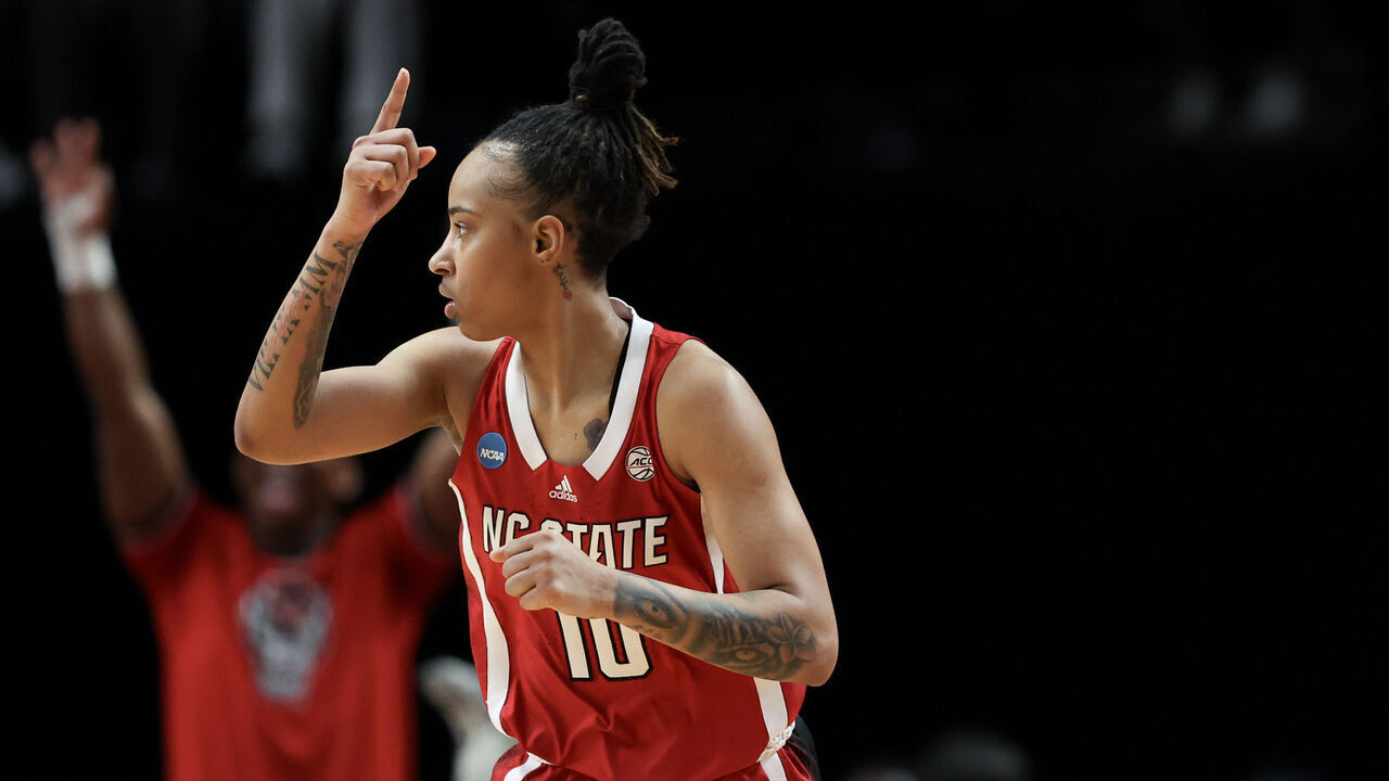 PORTLAND, OREGON - MARCH 31: Aziaha James #10 of the NC State Wolfpack reacts after making a three point basket during the second half against the Texas Longhorns in the Elite 8 round of the NCAA Women's Basketball Tournament at Moda Center on March 31, 2024 in Portland, Oregon.