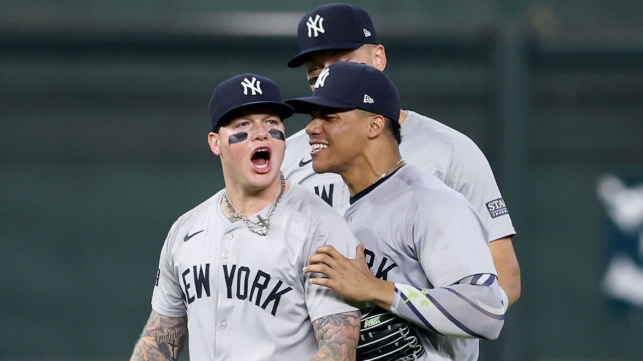 HOUSTON, TEXAS - MARCH 31: Juan Soto #22 of the New York Yankees congratulates Alex Verdugo #24 after he made a catch to end the game against the Houston Astros at Minute Maid Park on March 31, 2024 in Houston, Texas.