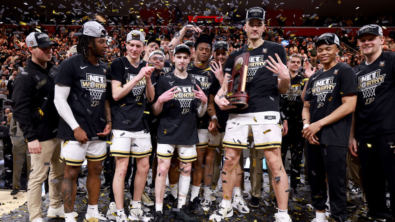 DETROIT, MICHIGAN - MARCH 31: Zach Edey #15 of the Purdue Boilermakers celebrates with his teammates after defeating the Tennessee Volunteers in the Elite 8 round of the NCAA Men's Basketball Tournament at Little Caesars Arena on March 31, 2024 in Detroit, Michigan.