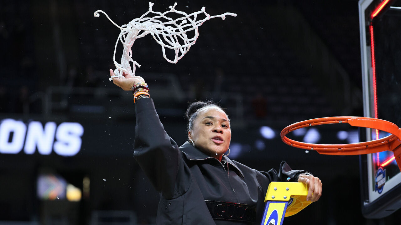 ALBANY, NEW YORK - MARCH 31: Head coach Dawn Staley of the South Carolina Gamecocks cuts down the net after beating the Oregon State Beavers 70-58 in the Elite 8 round of the NCAA Women's Basketball Tournament at MVP Arena on March 31, 2024 in Albany, New York.