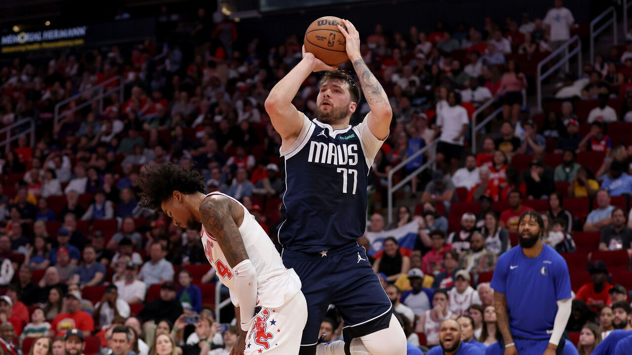 HOUSTON, TEXAS - MARCH 31: Luka Doncic #77 of the Dallas Mavericks shoots the ball while defended by Jalen Green #4 of the Houston Rockets in the first half at Toyota Center on March 31, 2024 in Houston, Texas.