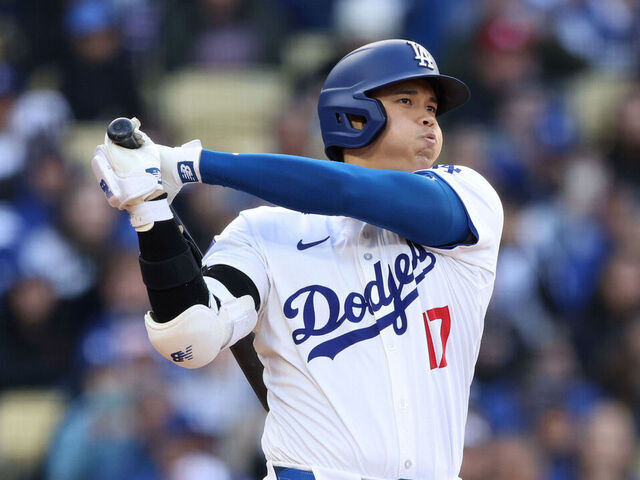 LOS ANGELES, CALIFORNIA - MARCH 31: Shohei Ohtani #17 of the Los Angeles Dodgers hits a double in the sixth inning against the St. Louis Cardinals at Dodger Stadium on March 31, 2024 in Los Angeles, California.