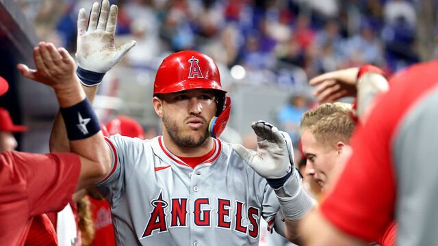 MIAMI, FLORIDA - APRIL 01: Mike Trout #27 of the Los Angeles Angels celebrates with teammates after hitting a home run against the Miami Marlins during the fourth inning of the game at loanDepot park on April 01, 2024 in Miami, Florida.