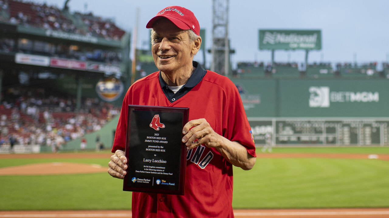 BOSTON, MA - AUGUST 29: Boston Red Sox President and CEO Emeritus Larry Lucchino is presented with the 2023 Boston Red Sox Jimmy Fund Award before a game between the Houston Astros and the Boston Red Sox on August 29, 2023 at Fenway Park in Boston, Massachusetts.