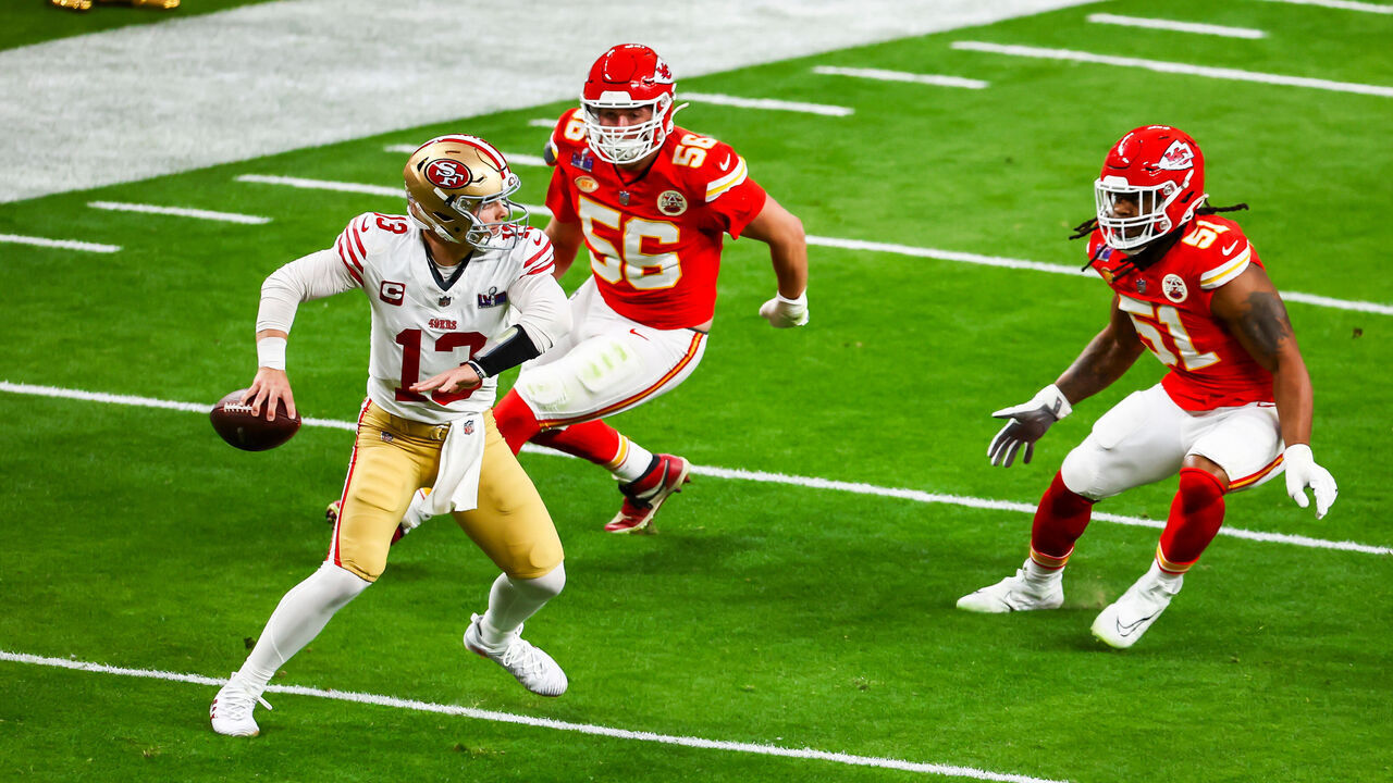 LAS VEGAS, NV - FEBRUARY 11: San Francisco 49ers quarterback Brock Purdy (13) attempts to pass the ball under pressure against Kansas City Chiefs defensive end George Karlaftis (56) and defensive end Mike Danna (51) during Super Bowl LVIII between the Kansas City Chiefs and the San Francisco 49ers on Sunday February 11, 2024 at Allegiant Stadium in Las Vegas, NV.