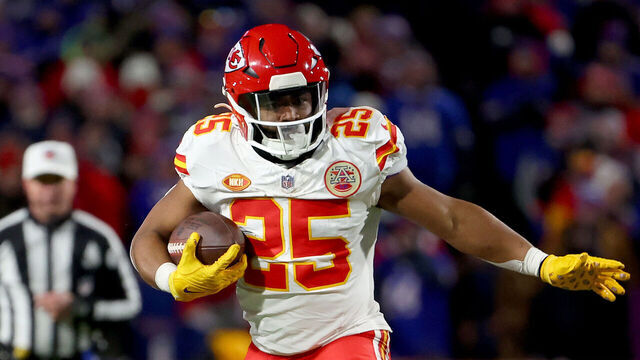 ORCHARD PARK, NEW YORK - JANUARY 21: Clyde Edwards-Helaire #25 of the Kansas City Chiefs breaks a tackle by Dane Jackson #30 of the Buffalo Bills during the second quarter in the AFC Divisional Playoff game at Highmark Stadium on January 21, 2024 in Orchard Park, New York.