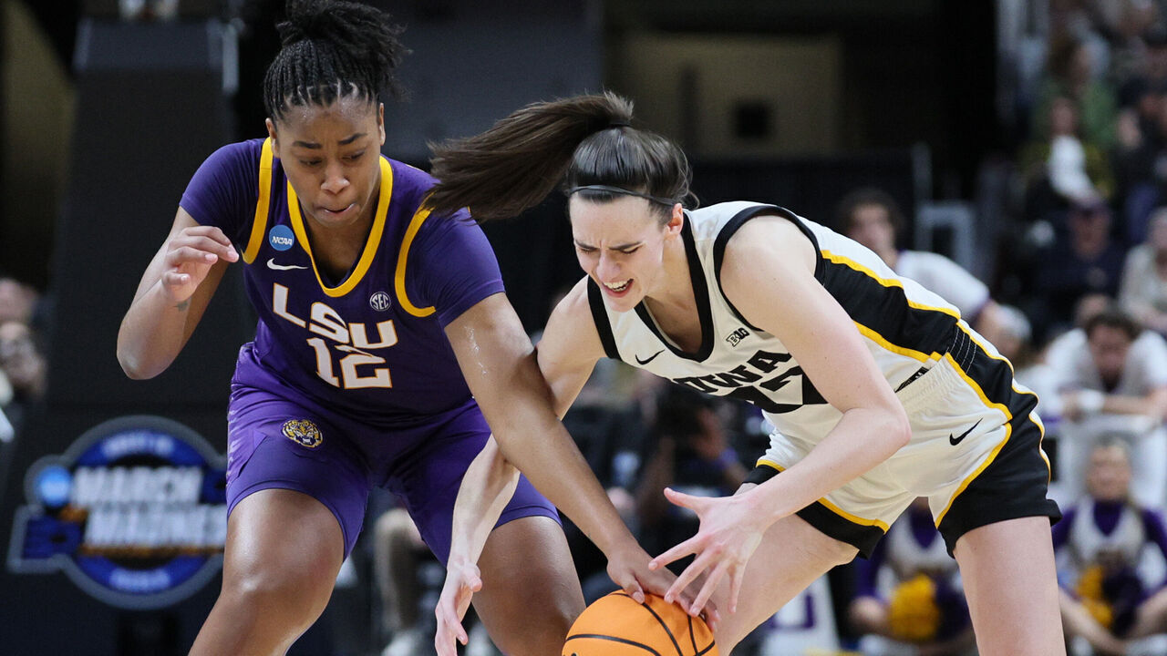 ALBANY, NEW YORK - APRIL 01: Mikaylah Williams #12 of the LSU Tigers and Caitlin Clark #22 of the Iowa Hawkeyes fight for the ball during the second half in the Elite 8 round of the NCAA Women's Basketball Tournament at MVP Arena on April 01, 2024 in Albany, New York.