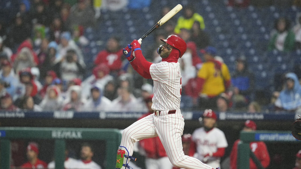 PHILADELPHIA, PENNSYLVANIA - APRIL 2: Bryce Harper #3 of the Philadelphia Phillies hits a solo home run in the bottom of the first inning against the Cincinnati Reds at Citizens Bank Park on April 2, 2024 in Philadelphia, Pennsylvania.