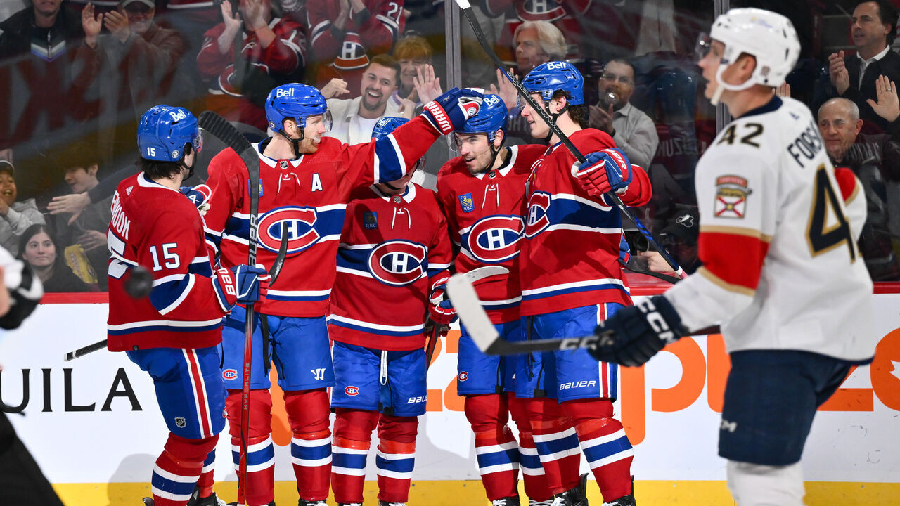 MONTREAL, CANADA - APRIL 02: Nick Suzuki #14 of the Montreal Canadiens celebrates his goal with teammates Alex Newhook #15, Mike Matheson #8, Cole Caufield #22 and Juraj Slafkovsky #20 during the second period against the Florida Panthers at the Bell Centre on April 2, 2024 in Montreal, Quebec, Canada.