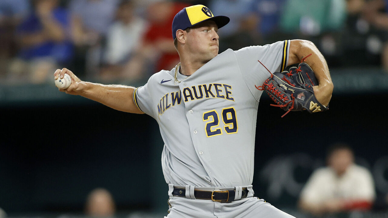 ARLINGTON, TEXAS - AUGUST 19: Trevor Megill #29 of the Milwaukee Brewers throws a pitch in the ninth inning against the Texas Rangers at Globe Life Field on August 19, 2023 in Arlington, Texas.