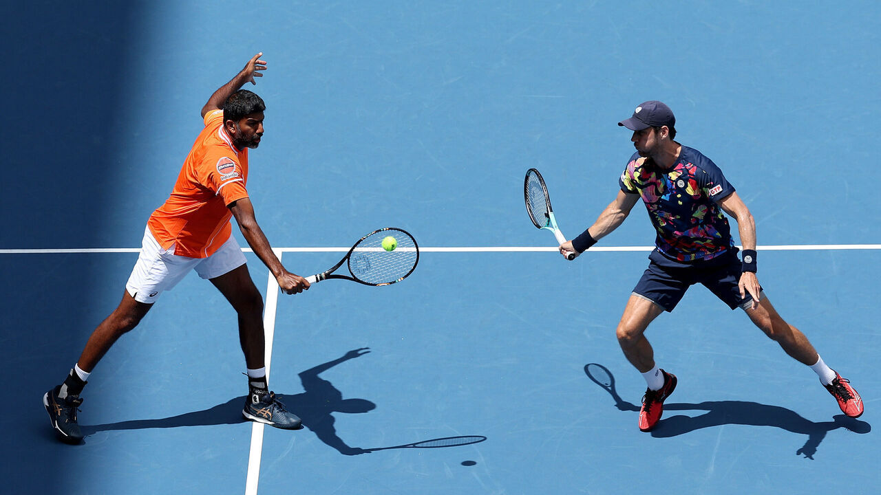 MIAMI GARDENS, FLORIDA - MARCH 30: Rohan Bopanna of India and Matthew Ebden of Australia return a shot to Austin Krajicek of the United States and Ivan Dodig of Croatia during the Men's Doubles Final at Hard Rock Stadium on March 30, 2024 in Miami Gardens, Florida.