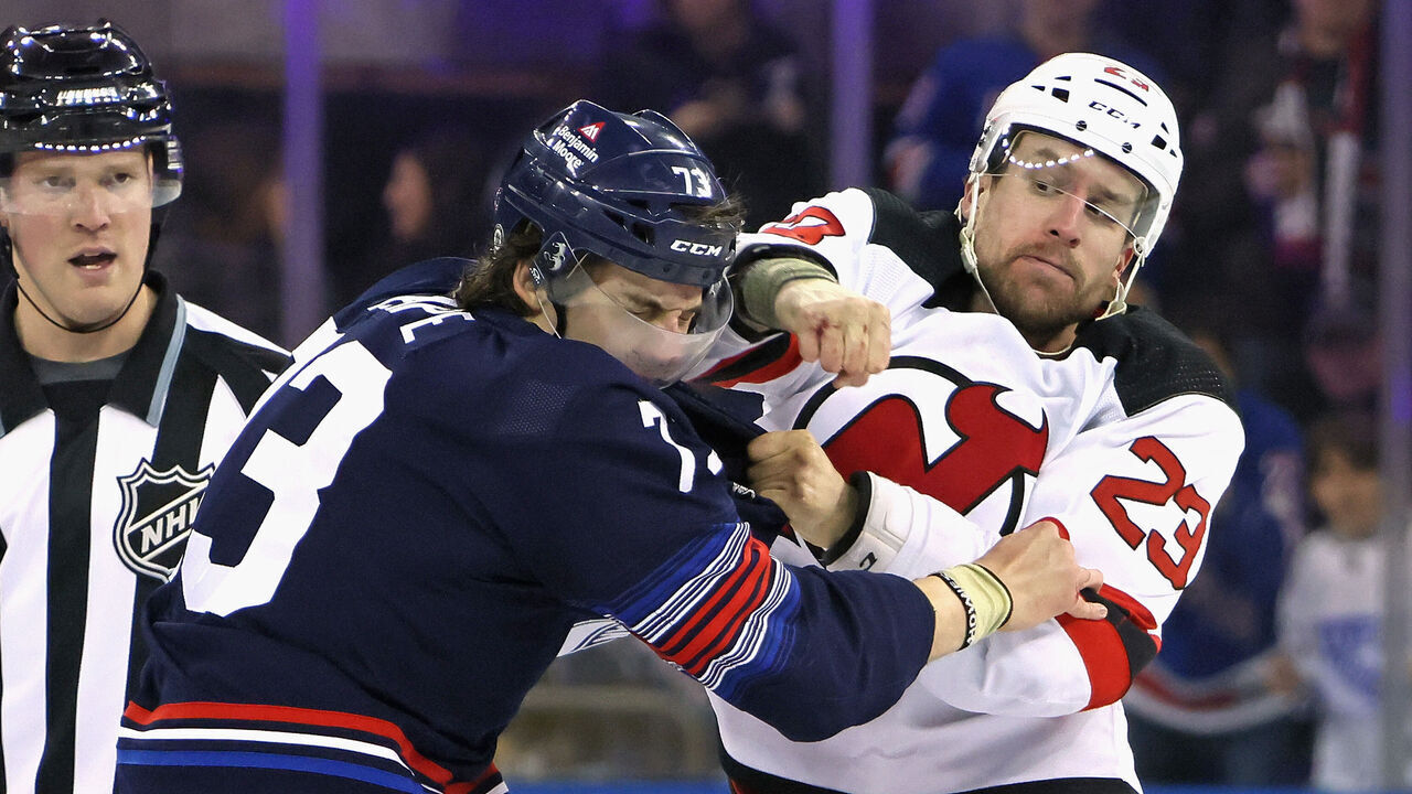 NEW YORK, NEW YORK - APRIL 03: Kurtis MacDermid #23 of the New Jersey Devils fights with Matt Rempe #73 of the New York Rangers during the first period at Madison Square Garden on April 03, 2024 in New York City.