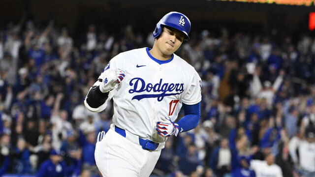 Los Angeles, CA - April 03: Shohei Ohtani #17 of the Los Angeles Dodgers reacts after hitting a solo home run (first of the year) against the San Francisco Giants in the seventh inning of a baseball game at Dodger Stadium in Los Angeles on Wednesday, April 3, 2024.