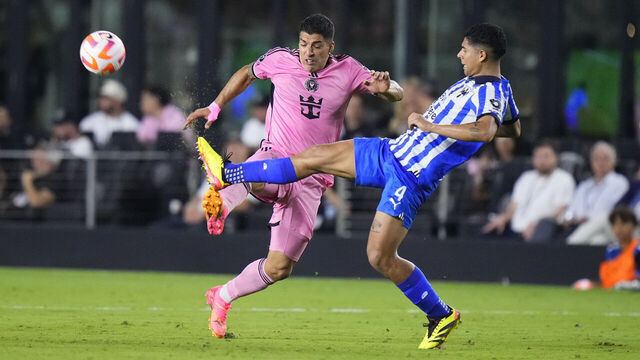 FORT LAUDERDALE, FLORIDA - APRIL 03: Luis Suárez #9 of Inter Miami and Víctor Guzmán #4 of Monterrey battle for the ball during the second half in the quarterfinals of the Concacaf Champions Cup - Leg One at Chase Stadium on April 03, 2024 in Fort Lauderdale, Florida.