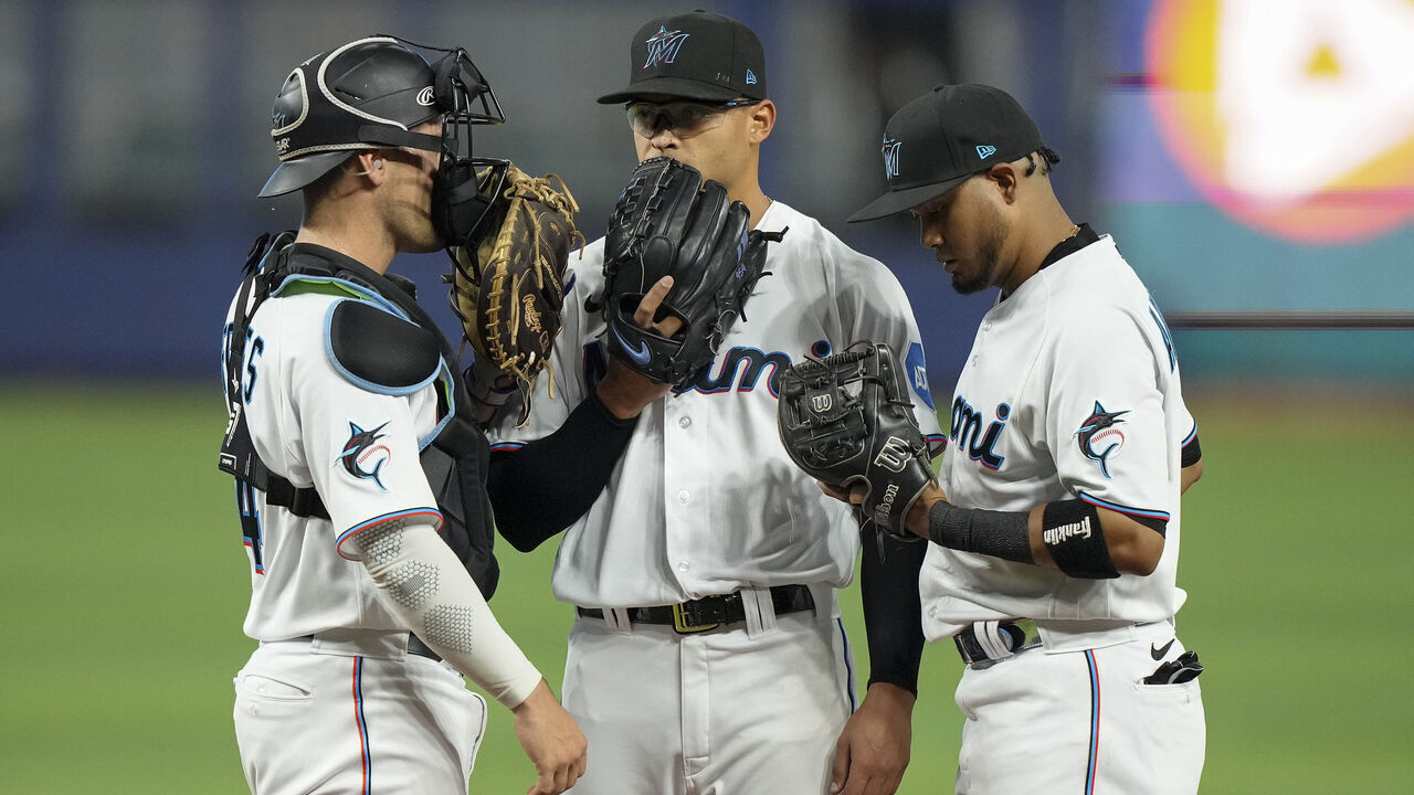 MIAMI, FLORIDA - APRIL 17: Catcher Nick Fortes #4 of the Miami Marlins talks with pitcher Jesus Luzardo #44 and second baseman Luis Arraez #3 during the second inning against the San Francisco Giants at loanDepot park on April 17, 2023 in Miami, Florida.