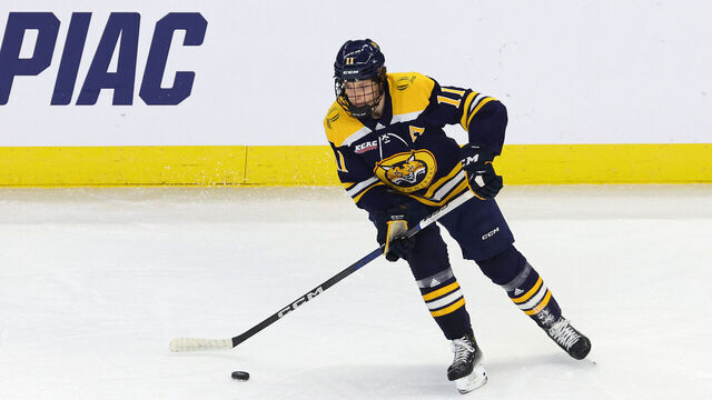 PROVIDENCE, RI - MARCH 31: Quinnipiac Bobcats forward Collin Graf (11) skates with the puck during the Quinnipiac Bobcats game versus the Boston College Eagles in the Providence Regional final of the NCAA Division I Men's Championship on March 31, 2024, at Amica Mutual Pavilion in Providence, RI.