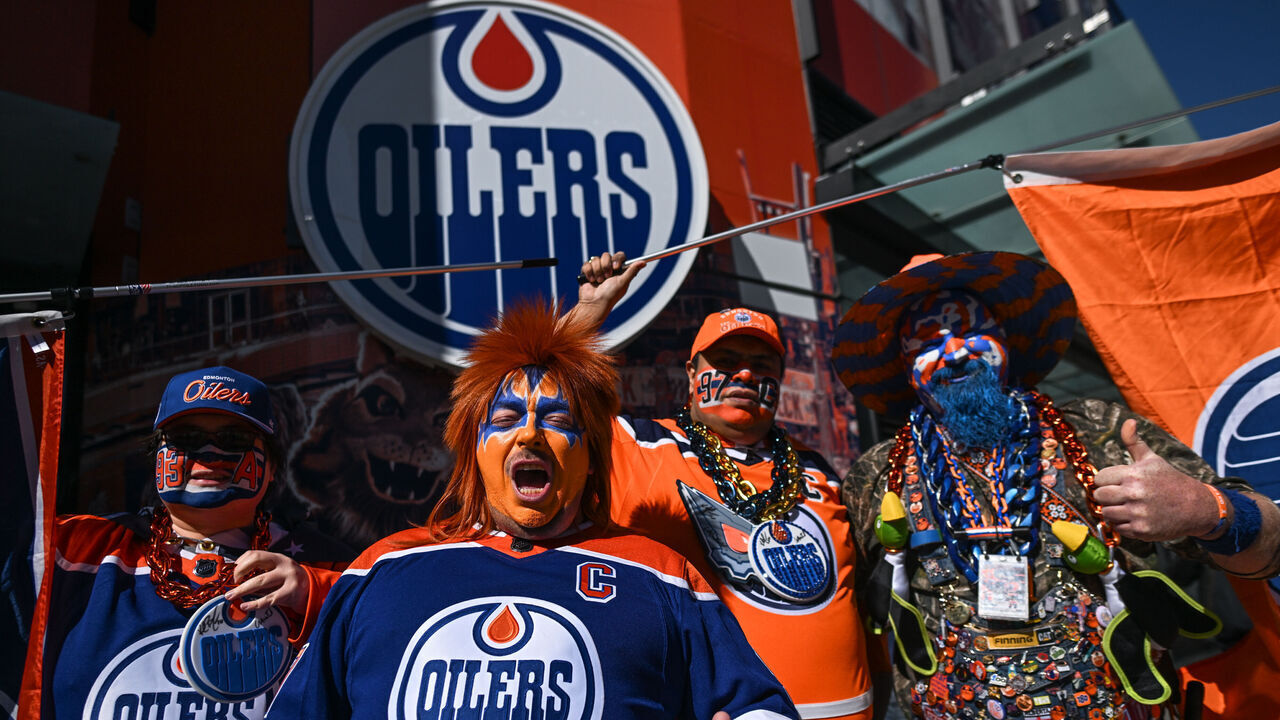 EDMONTON, CANADA - MARCH 30: Oilers fans pose for pictures ahead of the Edmonton Oilers vs. Anaheim Ducks NHL match, on March 30, 2024, in Edmonton, Alberta, Canada.