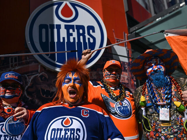 EDMONTON, CANADA - MARCH 30: Oilers fans pose for pictures ahead of the Edmonton Oilers vs. Anaheim Ducks NHL match, on March 30, 2024, in Edmonton, Alberta, Canada.