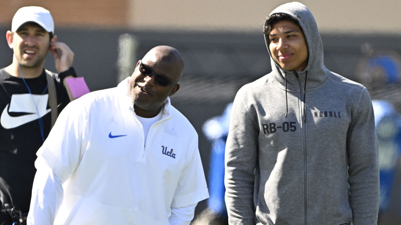 Westwood, CA - March 15: Offensive Coordinator Eric Bieniemy,left, of the UCLA Bruins with former bruin and current Seattle Seahawks Zach Charbonnet during Pro Day at Spaulding Field on the campus of UCLA in Westwood on Friday, March 15, 2024.