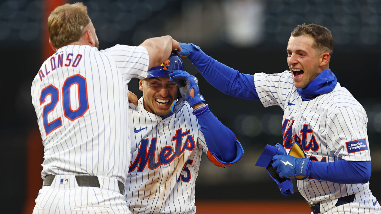 NEW YORK, NEW YORK - APRIL 4: Tyrone Taylor #15 of the New York Mets celebrates with Pete Alonso #20 and Zack Short #21 after hitting an RBI single in the ninth inning to defeat the Detroit Tigers 2-1 in game two of a double header at Citi Field on April 4, 2024 in New York City.