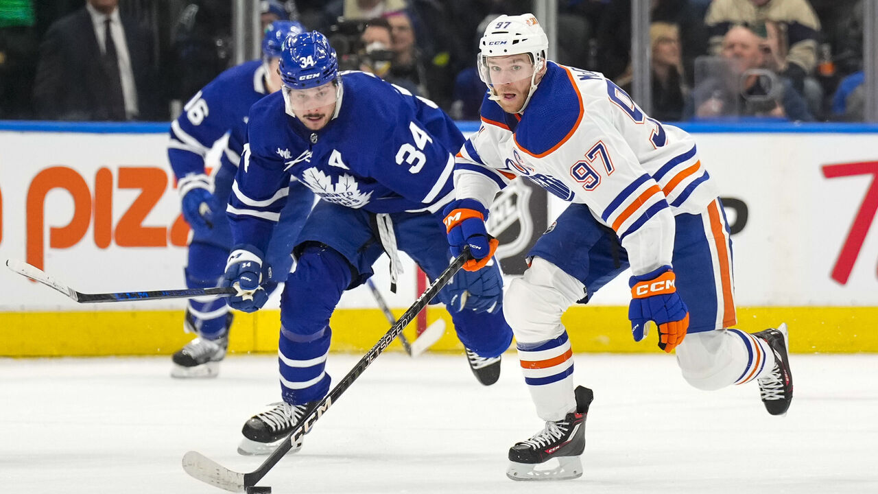 TORONTO, ON - MARCH 11: Connor McDavid #97 of the Edmonton Oilers skates against Auston Matthews #34 of the Toronto Maple Leafs during the first period at the Scotiabank Arena on March 11, 2023 in Toronto, Ontario, Canada.