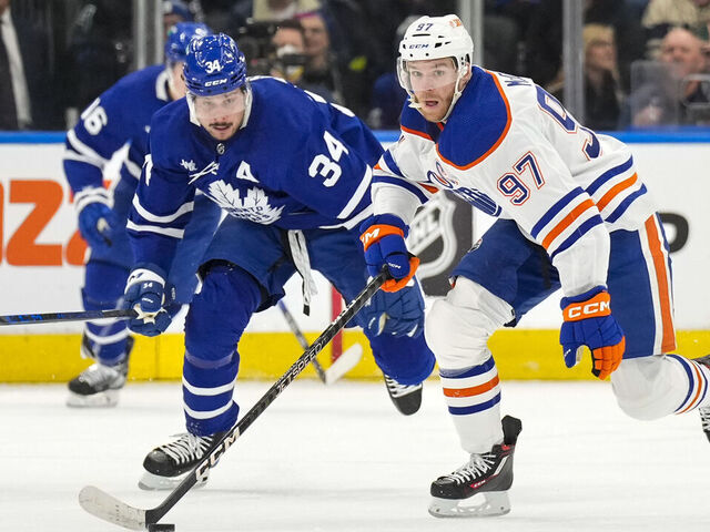 TORONTO, ON - MARCH 11: Connor McDavid #97 of the Edmonton Oilers skates against Auston Matthews #34 of the Toronto Maple Leafs during the first period at the Scotiabank Arena on March 11, 2023 in Toronto, Ontario, Canada.