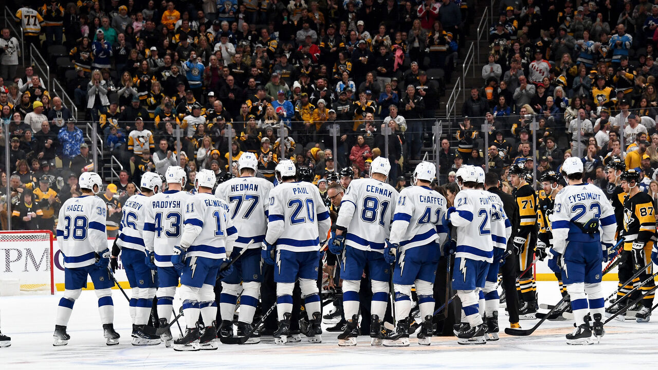 PITTSBURGH, PA - APRIL 06: Referee Steve Kozari is surrounded by players while being carted off the ice during the game between the Tampa Bay Lightning and the Pittsburgh Penguins at PPG PAINTS Arena on April 6, 2024 in Pittsburgh, Pennsylvania.