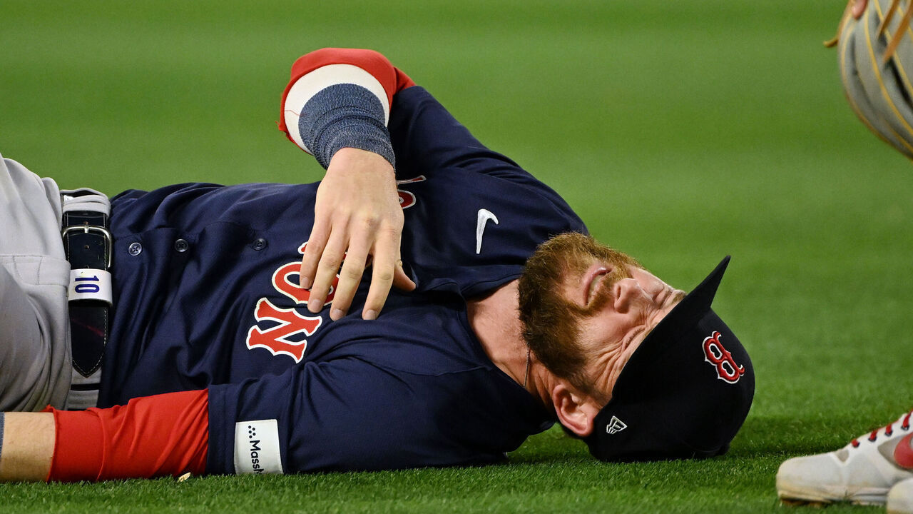 ANAHEIM, CA - APRIL 05: Boston Red Sox shortstop Trevor Story (10) lies on the ground after diving for a ground ball during an MLB baseball game against the Los Angeles Angels played on April 5, 2024 at Angel Stadium in Anaheim, CA.