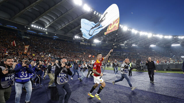 ROME, ITALY - APRIL 6: Gianluca Mancini of AS Roma celebrates at the end of the match by waving a flag against SS Lazio during the Serie A TIM match between AS Roma and SS Lazio at Stadio Olimpico on April 6, 2024 in Rome, Italy.