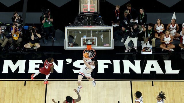 GLENDALE, ARIZONA - APRIL 06: (EDITORS NOTE: Image taken using a remote camera.) Donovan Clingan #32 of the Connecticut Huskies dunk during the first half in the NCAA Men’s Basketball Tournament Final Four semifinal game against the Alabama Crimson Tide at State Farm Stadium on April 06, 2024 in Glendale, Arizona.