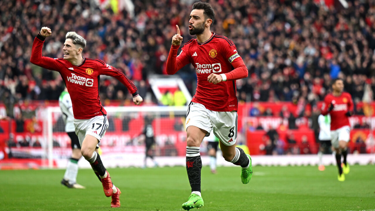 MANCHESTER, ENGLAND - APRIL 07: Bruno Fernandes of Manchester United celebrates scoring his team's first goal during the Premier League match between Manchester United and Liverpool FC at Old Trafford on April 07, 2024 in Manchester, England.