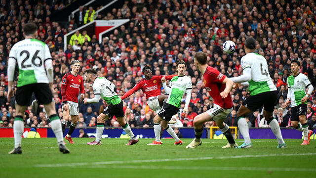 MANCHESTER, ENGLAND - APRIL 07: Kobbie Mainoo of Manchester United scores his team's second goal during the Premier League match between Manchester United and Liverpool FC at Old Trafford on April 07, 2024 in Manchester, England.